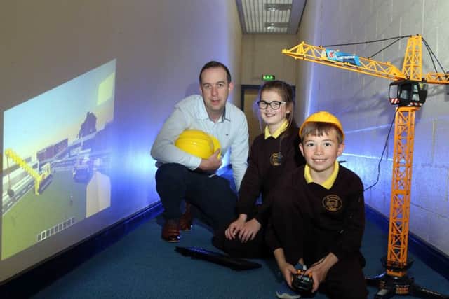 David Comiskey of UUs newly formed Belfast School of Architecture with pupils Niamh Martin and Rory Goss