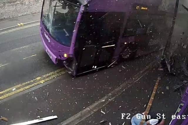 CCTV footage outside the Purple Turtle Bar in Reading showing a pedestrian appearing to have a lucky escape after being struck down by a bus as he crossed Gun Street.