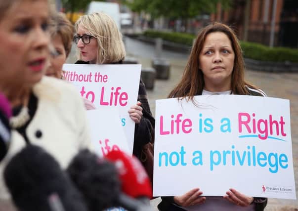 Anti-abortion campaigners outside the Royal Courts of Justice, Belfast: Thursday June 29, 2017.