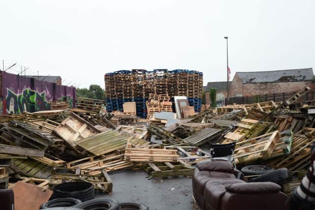 A car park in east Belfast has been closed to the public. Thousands of wooden pallets are now piled up where previously there were parked cars.
The bonfire makers are involved in a dispute with the city council over the storing of pallets.
Photo Pacemaker Press