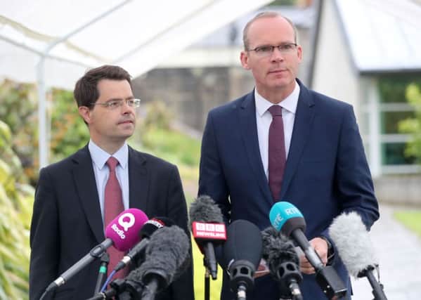 Northern Ireland Secretary James Brokenshire (left) looks on as Foreign Affairs minister Simon Coveney speaks to the media at Stormont, Belfast: Thursday June 29, 2017.