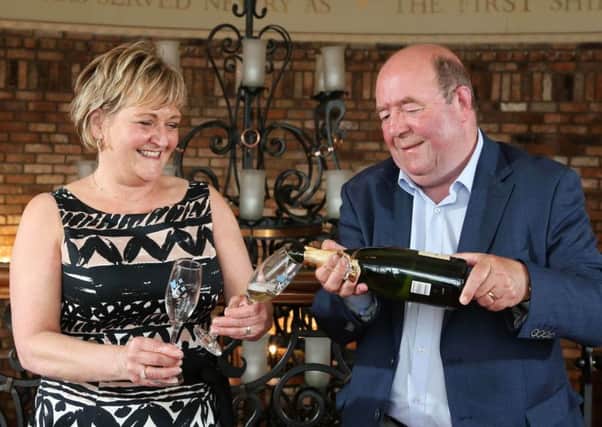 Retired couple Colin and Eithne Bell celebrate becoming  Northern Irelands latest lottery winners