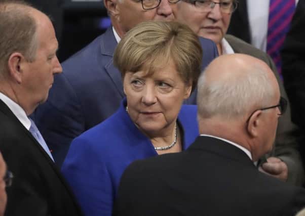 German chancellor Angela Merkel waits for the voting procedure to begin after a debate of the German parliament Bundestag on the gay marriage in Berlin. (AP Photo/Markus Schreiber)