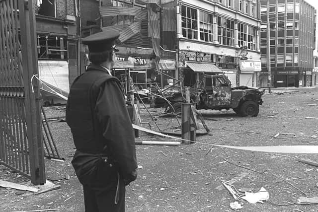 An RUC man at the scene of an IRA bomb in Belfast city centre in 1987 in which two UDR men were killed. Barra McGrory believes the vast majority of security force members during the Troubles acted with integrity. Picture Pacemaker