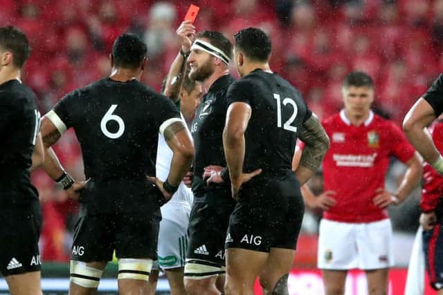 All Blacks' Sonny Bill Williams (12) is shown a red card by referee Jerome Garces