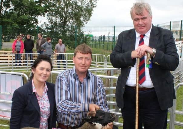 Judge Ken Fletcher congratulates Veronica and Patrick Fullerton, from Draperstown, on winning the Sheep Inter-Breed Championship at Omagh Show 2017