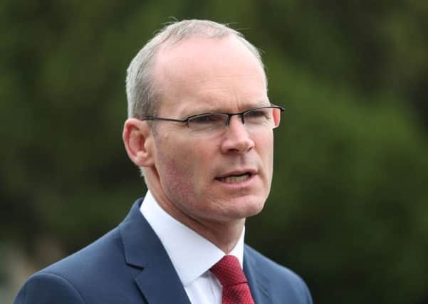 Irish Minister for Foreign Affairs Simon Coveney speaking to the media at Stormont Castle in Belfast on Monday, June 26, 2017.  Photo credit: Niall Carson/PA Wire