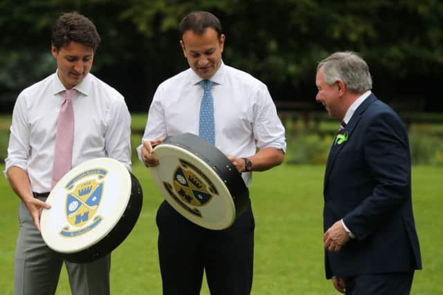 Canadian Prime Minister Justin Trudeau and Irish Taoiseach Leo Varadkar are each given a Bodhran (Irish drum) after holding a press conference at Farmleigh House in Dublin.  Niall Carson/PA Wire