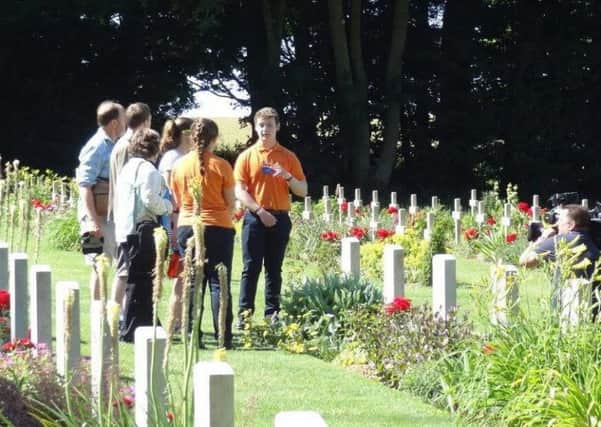 Andrew Brolly pictured working in France. Pic courtesy of the CWGC.
