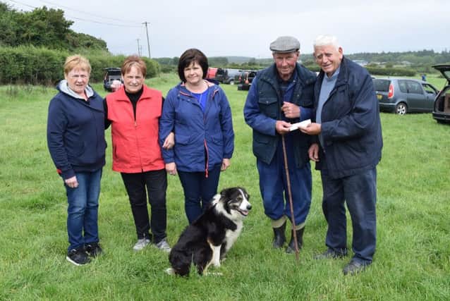 Downhill Sheepdog Society committee members pictured receiving sponsor cheque from William King