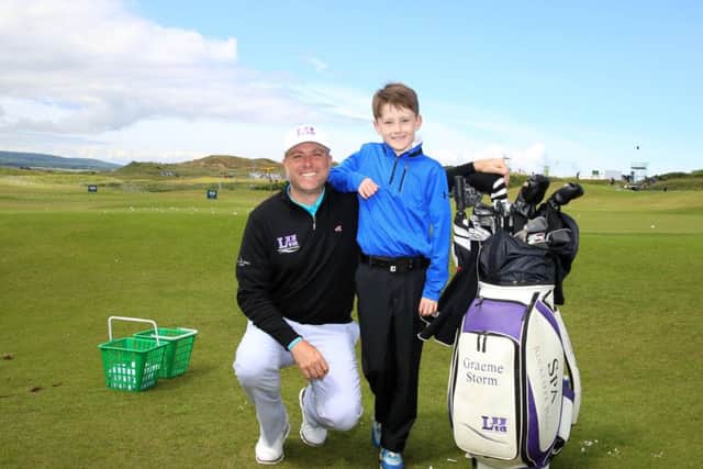 Charlie Smyth, 9, from Cavan received a golfing lesson at Portstewart Golf Club with golfer Graeme Storm. Picture by Darren Kidd /Press Eye.