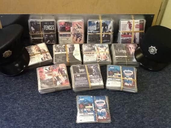 The counterfeit DVDs were seized by police officers on Thursday.