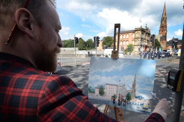 Pacemaker Press 12/7/2017
A local Artist records the The 12th of July Parade which  takes place from from Clifton Street threw the streets of Belfast on Wednesday, As thousands of people line the streets across Northern Ireland the 12th of July celebrations.
Pic Colm Lenaghan/Pacemaker