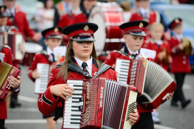 A member of Mulnahunch Accordian band leading the parade in Clogher.  Picture: Ronan McGrade