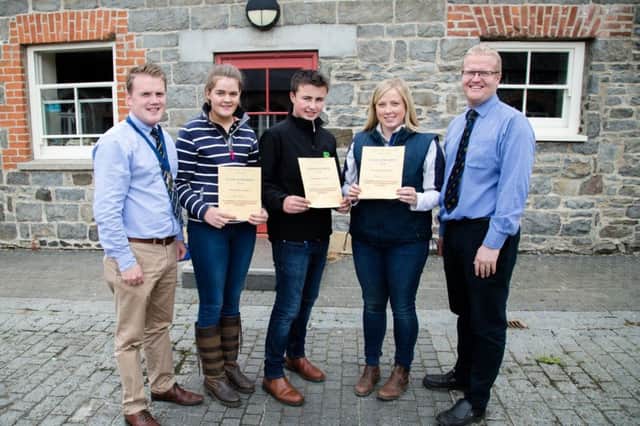 YFCU President James Speers is pictured with some of the winners of the YFCU Silage Assessment Finals. (L-R) 1st (16-18) Emma Donnelly, Annaclone & Magherally YFC; 1st (12-14) Ryan Rodgers, Annaclone & Magherally YFC; 1st (25-30) Stephanie McCollam, Lylehill YFC and Silage Assessment judge Ronald Annett. Not pictured 1st place winners: (21-25) Michael Torrens, Garvagh YFC; (18-21) Zoe Maguire, Bleary YFC and (14-16) Kathryn Morton, Bleary YFC.