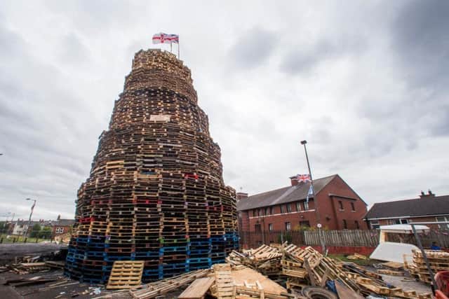 A loyalist bonfire at Bloomfield Walkway in Belfast. Police in Northern Ireland have warned their resources could be stretched amid growing fears of tension around the burning of Eleventh night bonfires.