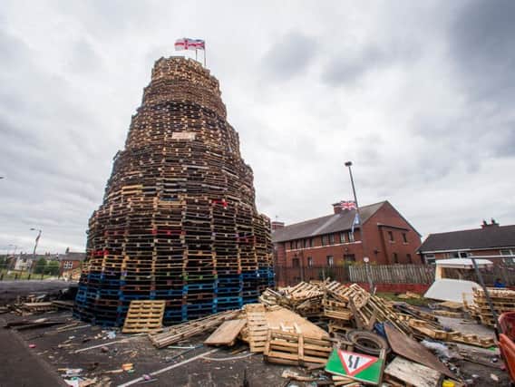 A loyalist bonfire at Bloomfield Walkway in Belfast. Police in Northern Ireland have warned their resources could be stretched amid growing fears of tension around the burning of Eleventh night bonfires.