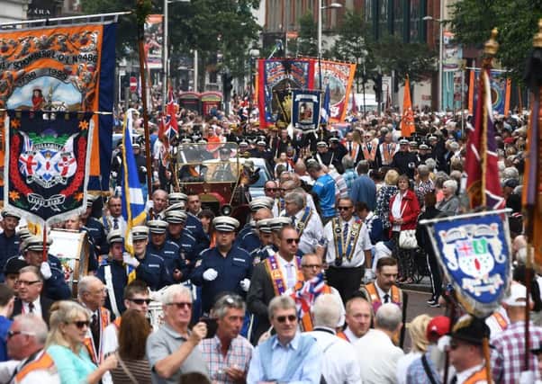 Donegall Place is a mass of people and colour as the Belfast parade made its way through the city centre yesterday