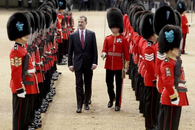 King Felipe VI of Spain inspects a guard of honour during a Ceremonial Welcome on Horse Guards Parade in London. . Photo: Matt Dunham/PA Wire
