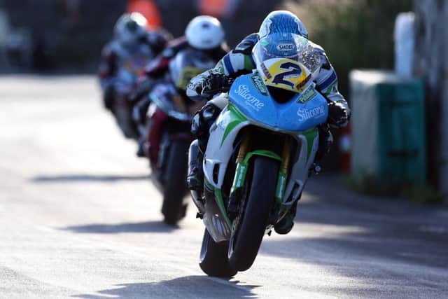 Dean Harrison (Silicone Kawasaki) leads James Cowton (McAdoo Kawasaki) and Michael Dunlop (MD Racing Yamaha)  on his way to victory in the Supersport race at the Southern 100