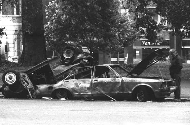 File photo dated 21/07/82 of police forensic officers working on the remains of the IRA car which housed the Hyde Park car bomb in which four soldiers died