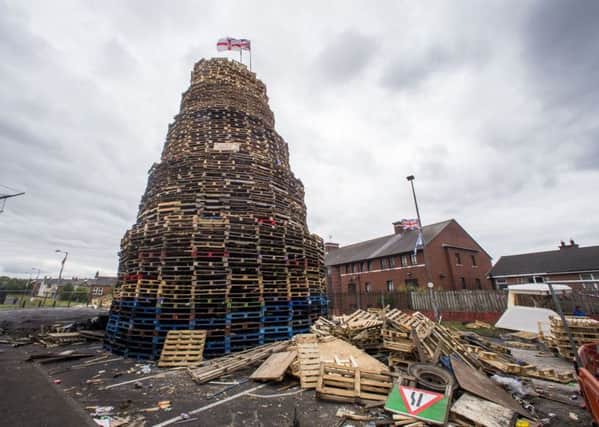 A loyalist bonfire at Bloomfield Walkway in Belfast. Police in warned their resources could be stretched from the burning of Eleventh night bonfires. Photo: PA Wire