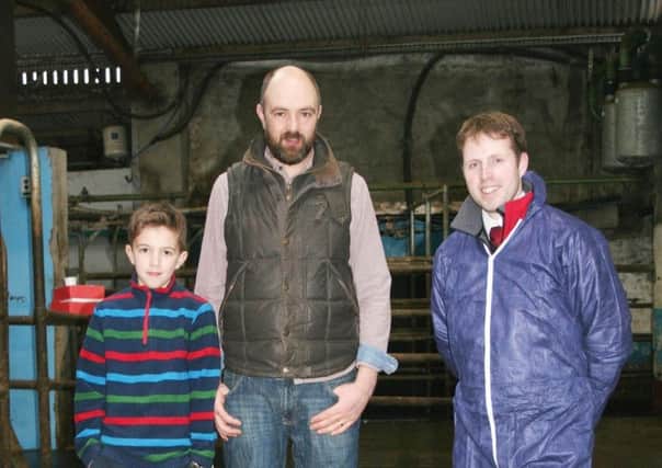 Coleraine dairy farmer Andrew McCollum (centre), his son & Jeff Haslett, from Moore Concrete.