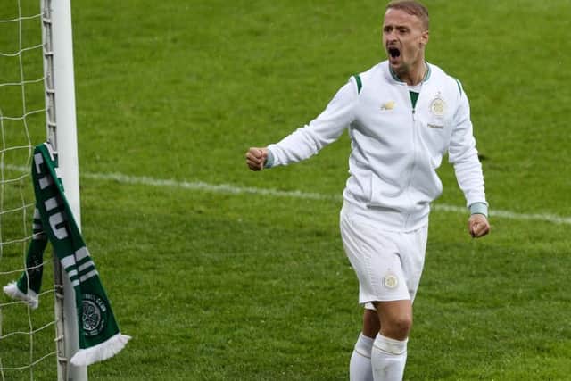 Celtic's Leigh Griffiths ties a scarf to the goal post after the Champions League game at the National Stadium Windsor Park.
Photo: Colm Lenaghan/Pacemaker Press