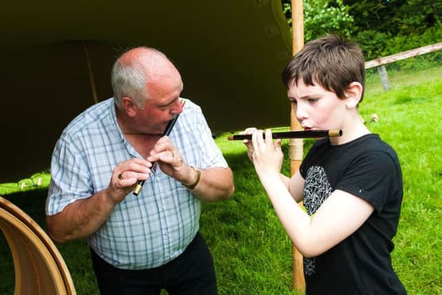 A young flautist gets some pointers during a workshop at the new cultural field at Scarva