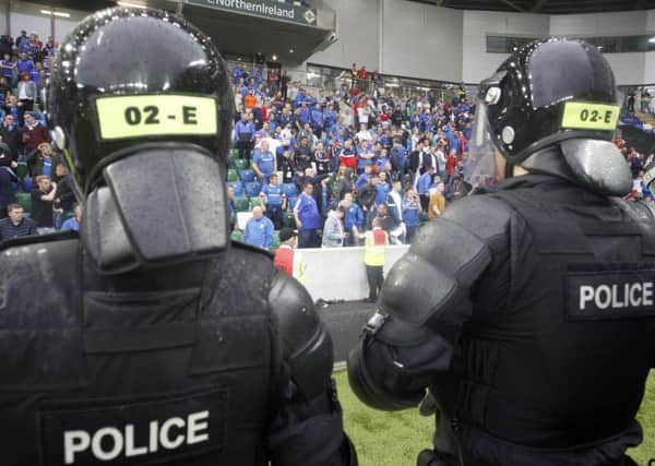 Riot police on the field follwing the Linfield and Celtic game at Windsor Park.