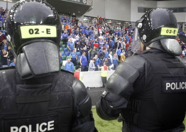 Riot police on the field following the Linfield-Celtic game at Windsor Park last Friday
