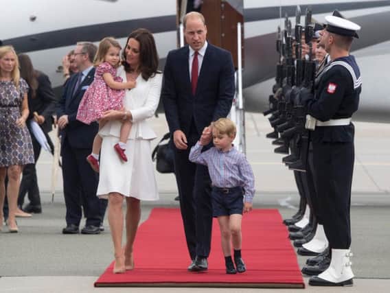 The Duke and Duchess of Cambridge arrive at Warsaw's Chopin Airport with Prince George and Princess Charlotte for the start of their five-day tour of Poland and Germany.