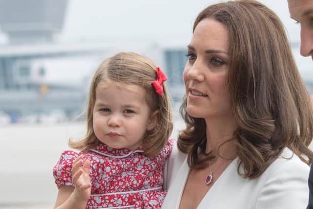 The Duchess of Cambridge at Warsaw's Chopin Airport with Princess Charlotte at the start of their five-day tour of Poland and Germany.