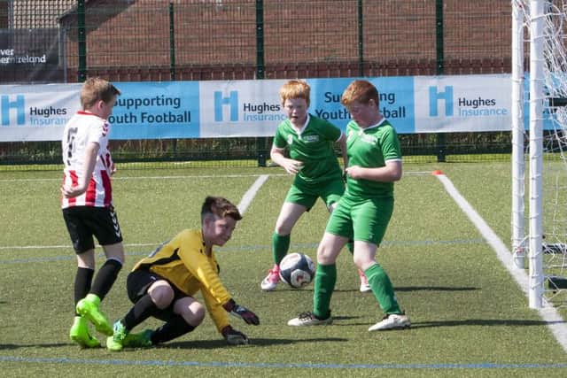 Goalmouth action during Illies Celtic v Tristar