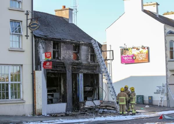 A fast food outlet and a first floor flat have sustained major damage in an overnight fire in Banbridge. This is the second fire at the premises in two weeks.
