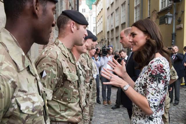 The Duke and Duchess of Cambridge meet British soldiers from the Light Dragoons serving in Poland during a visit to Gdansk on the second day of their three-day tour of Poland.