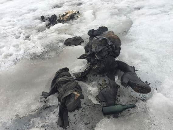 In this photo released by the Swiss train company ' Glacier 3000' shoes and clothing are visible at a Swiss glacier where two bodies were found.