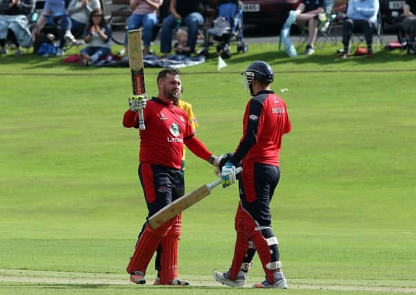 James Hall celebrates his brilliant century for Waringstown in Sunday's Lagan Valley Steels Twenty20 Cup final victory over North Down at The Lawn