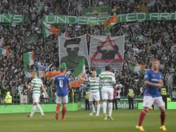 Celtic fans display banners during the second leg clash with Linfield. Picture: Getty
