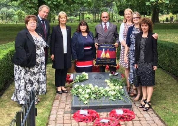 Danny Kinahan (second left) with relatives the Hyde Park bomb victims at a memorial stone