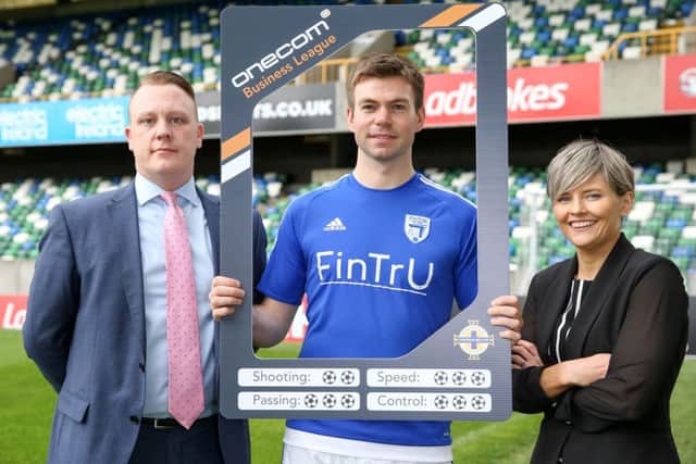 Launching the Onecom Business League is Paul Lawther of Onecom, FinTrU captain Mark McKeown and Irish FA director Oonagh OReilly