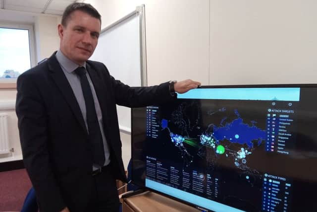 Head of the PSNI Cyber Crime Unit, DCI Dougie Grant,  presents a recording of a live time analysis of 1% of hostile internet attacks across the globe. Each one of these 'missile strikes' is a cyber attack.