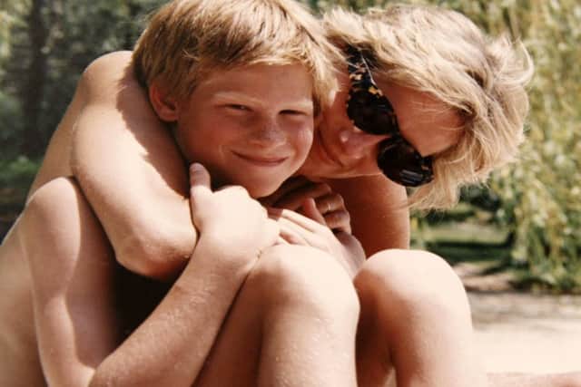 Diana, Princess of Wales, with Prince Harry on holiday