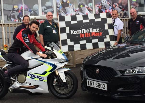 Motorcycle racer Glenn Irwin with Supt Sean Wright, PSNI District Commander for Lisburn and Castlereagh; Noel Johnston, Ulster Grand Prix clerk of course; Kieran Lawless, Northern Ireland Fire and Rescue Service; and Jeff McClure, Northern Ireland Ambulance Service.