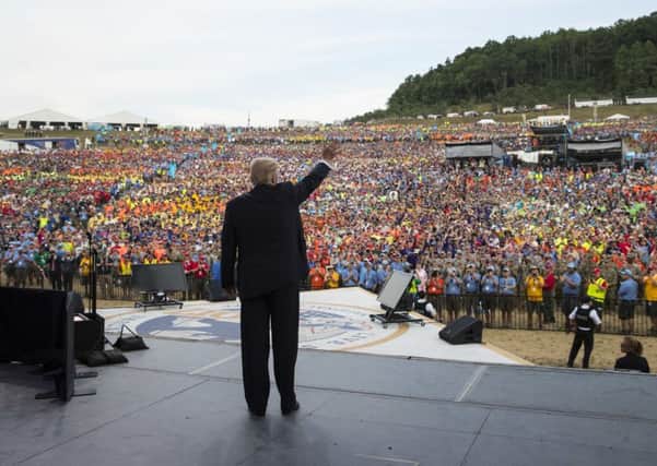 President Donald Trump waves to the crowd after speaking at the 2017 National Scout Jamboree in Glen Jean, W.Va., Monday, July 24. (AP Photo/Carolyn Kaster)