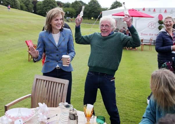 Pistols at dawn on the lawns of Stormont ... presenter Fiona Bruce shares a laugh during Saturdays filming of the Antiques Roadshow in Belfast