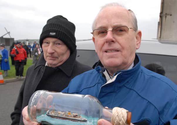 George Bouma made a presentation of a model of the MV Princess Victoria in a bottle and presented it to one of the survivors of the 1953 tragedy, William McAllister, at the Memorial Service in Larne. INLT 05-351-PR
