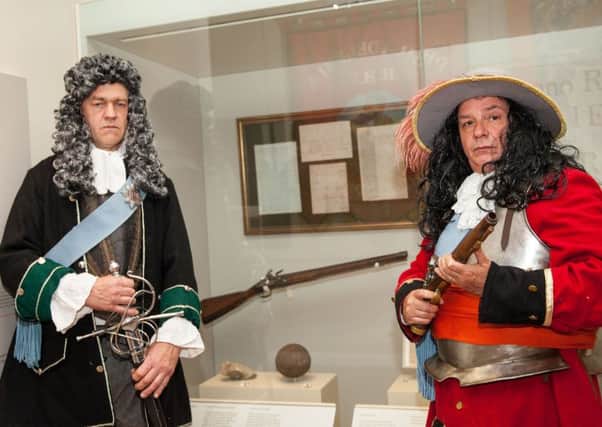 King William (right) and King James pictured with the Jacobite musket at the Museum of Orange Heritage in Belfast ahead of Boyne Day later this month