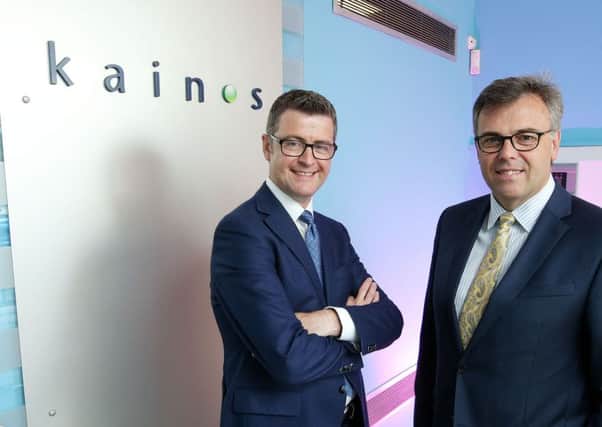 Kainos CEO Dr Brendan Mooney with Invest NI CEO Alastair Hamilton