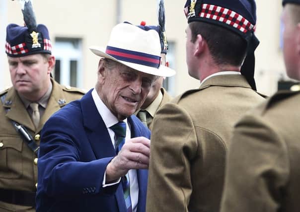 Prince Philip, pictured meeting troops in 2014, has supported the Queen as head of state for more than 65 years